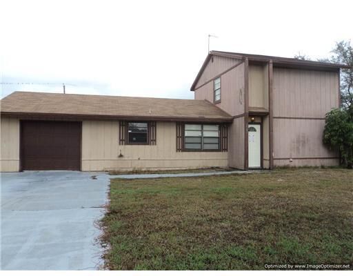 Property Photo:  2542 SE Floresta Drive  FL 34984 