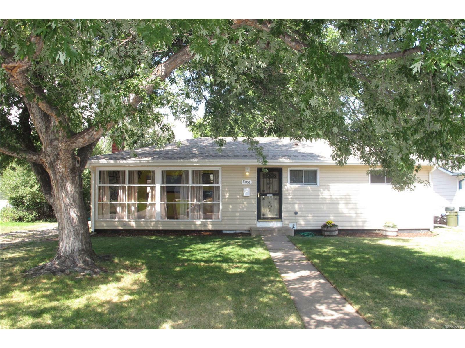 Property Photo:  5051 South Fox Street  CO 80110 