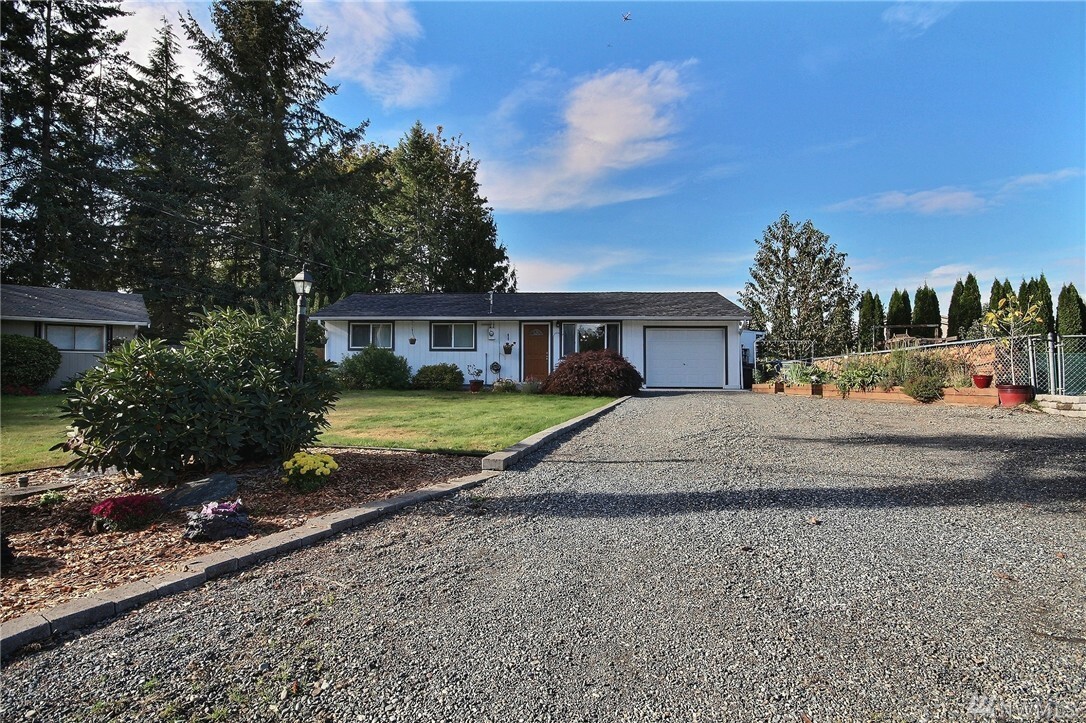 Property Photo:  10607 10th St Ct E  WA 98372 