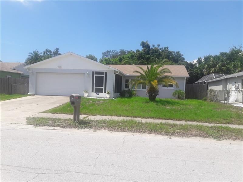 Property Photo:  7607 Bramblewood Drive  FL 34668 
