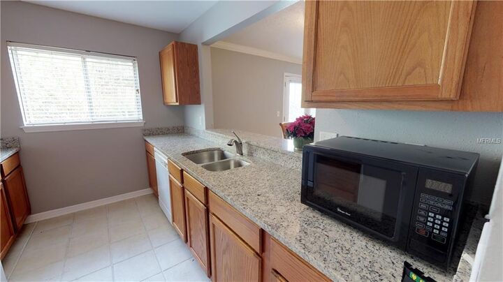 Property Photo:  1989 Toucan Way 100  FL 34232 