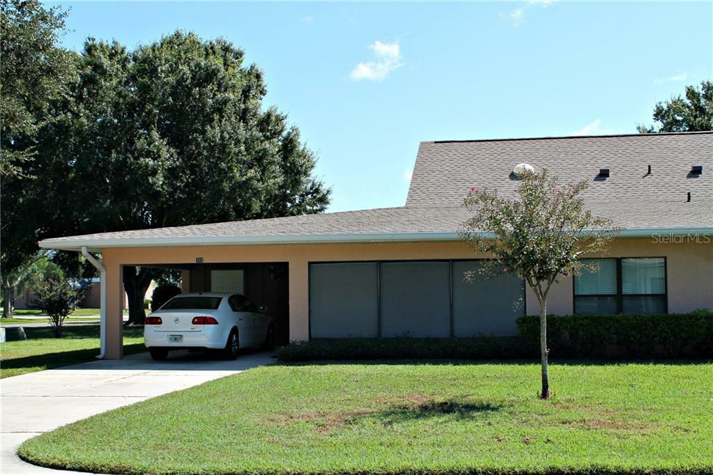 Property Photo:  302 Genesis Pointe Drive 11-2  FL 33859 