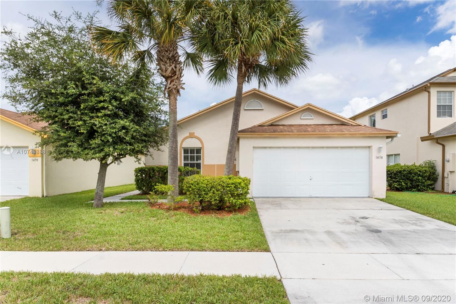 Property Photo: 1438 Red Apple Ln FL 33415