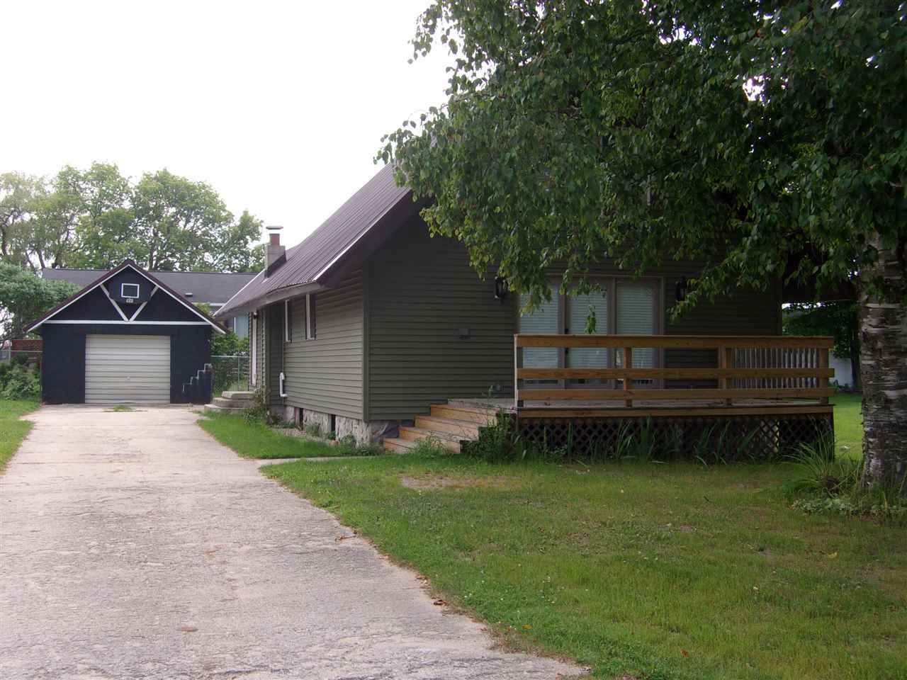 Property Photo:  406 Robinson  MI 49720 