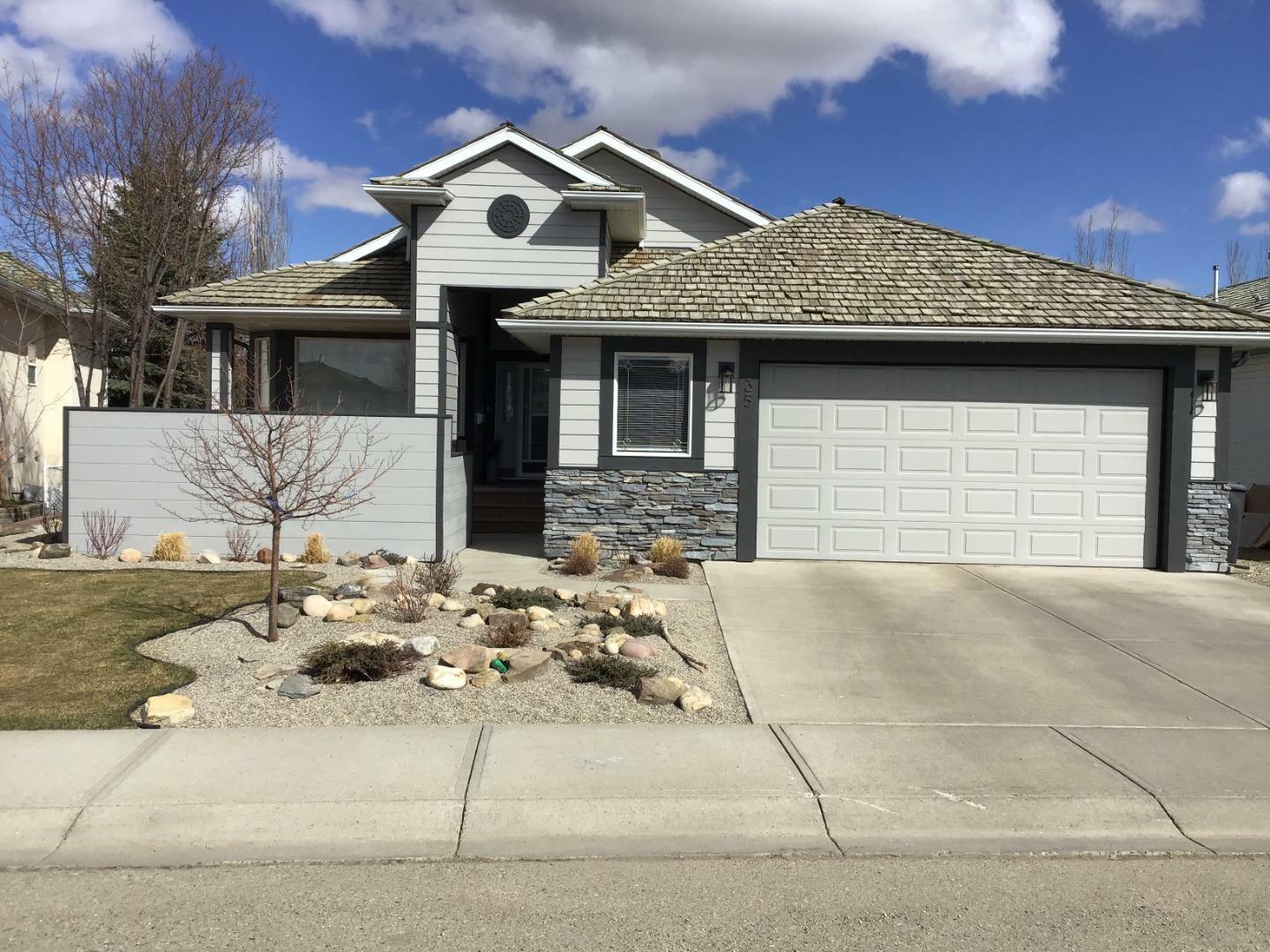 Property Photo: 35 Strathmore Lakes Way AB T1P 1R1