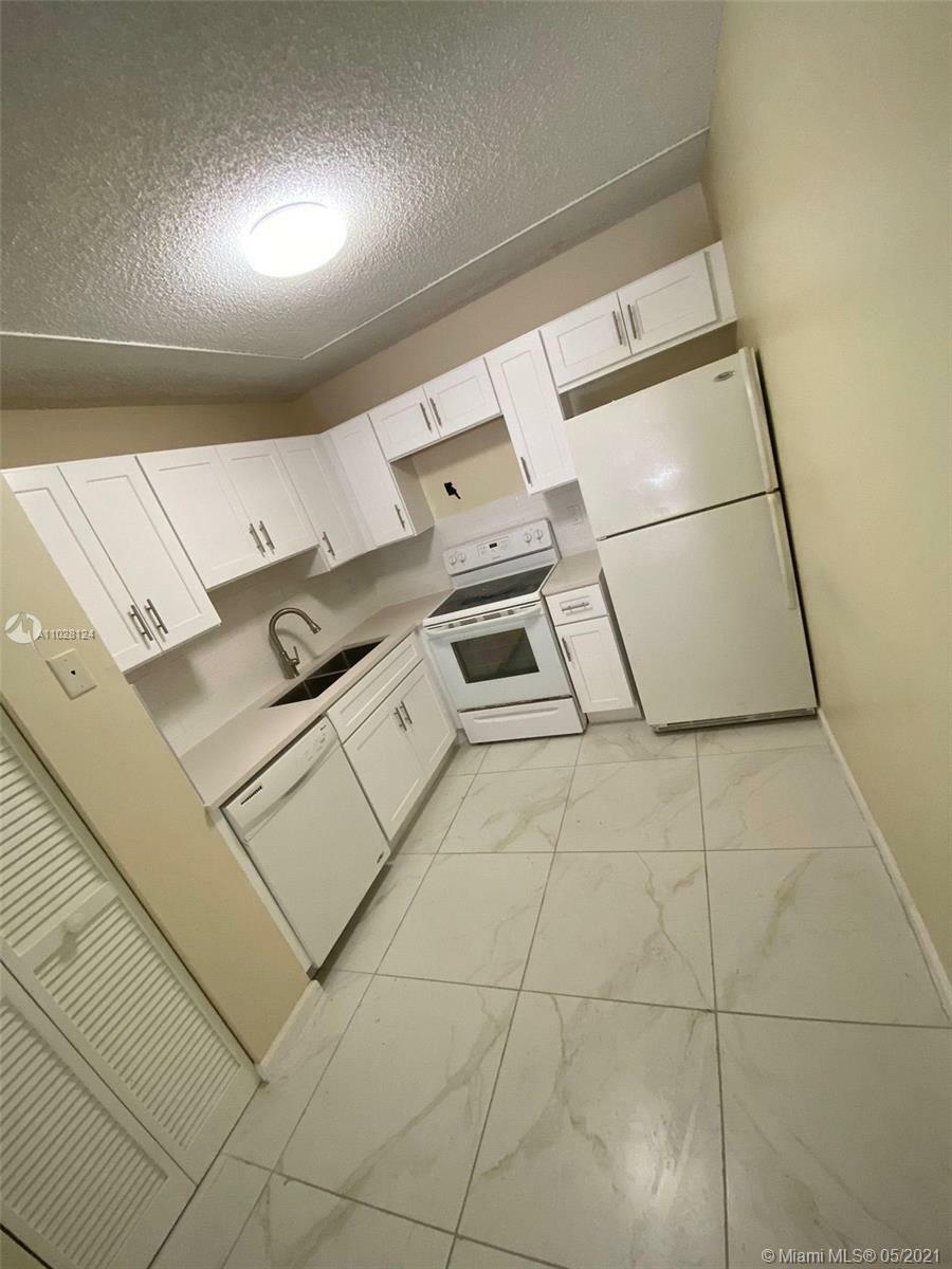 Property Photo:  10754 Royal Palm Blvd 8-4  FL 33065 