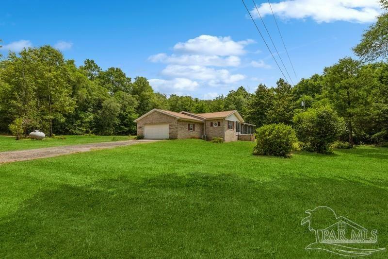 Property Photo:  7750 Lund Rd  FL 32570 