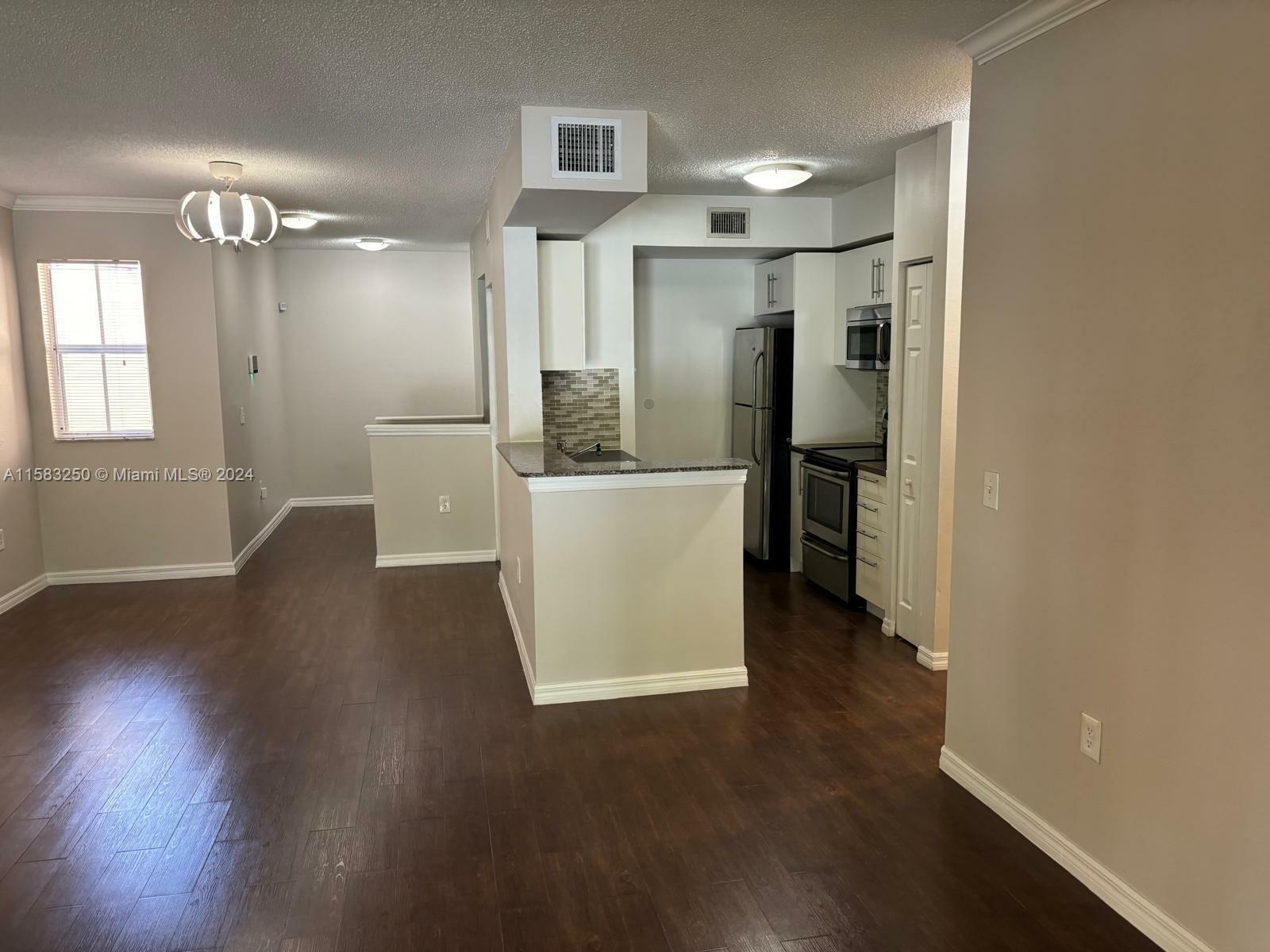 Property Photo:  2442 Centergate Dr 202  FL 33025 