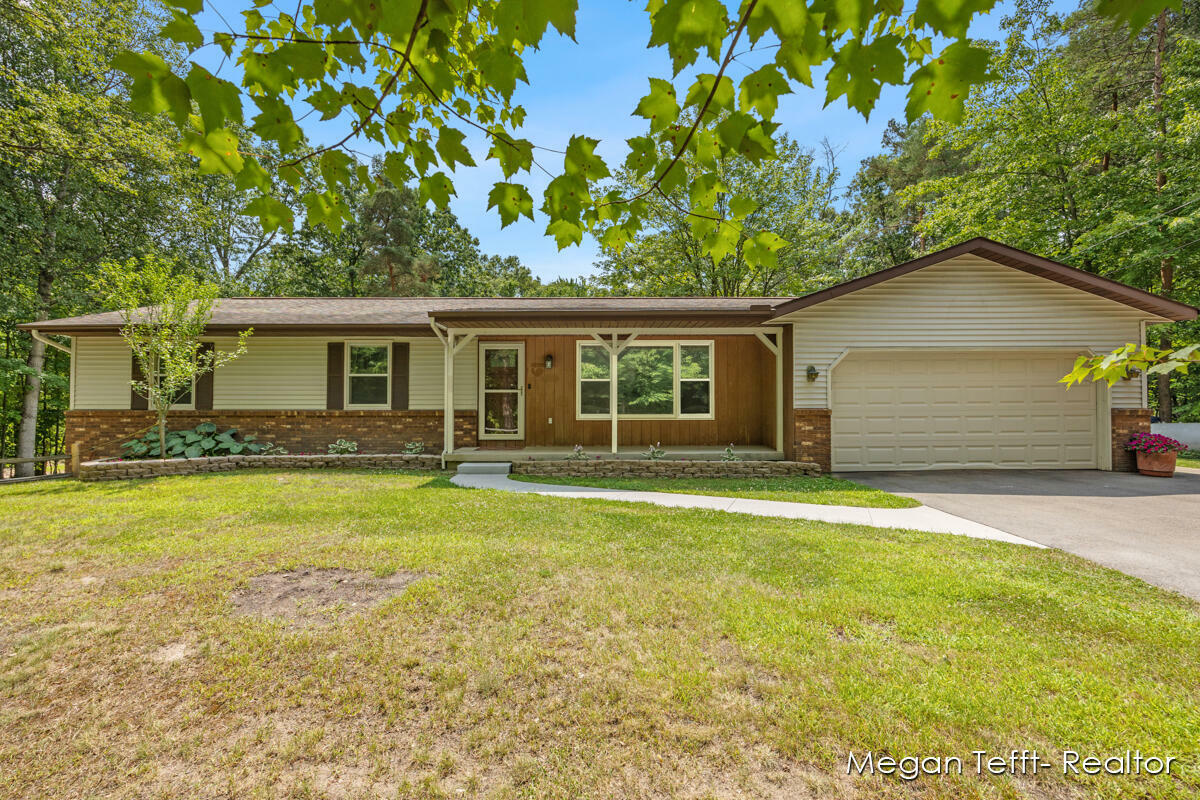 Property Photo:  6055 Pickerel Drive NE  MI 49341 