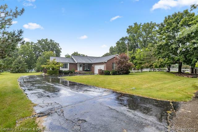 Property Photo:  16362 Paddock Club Boulevard  MI 48451 