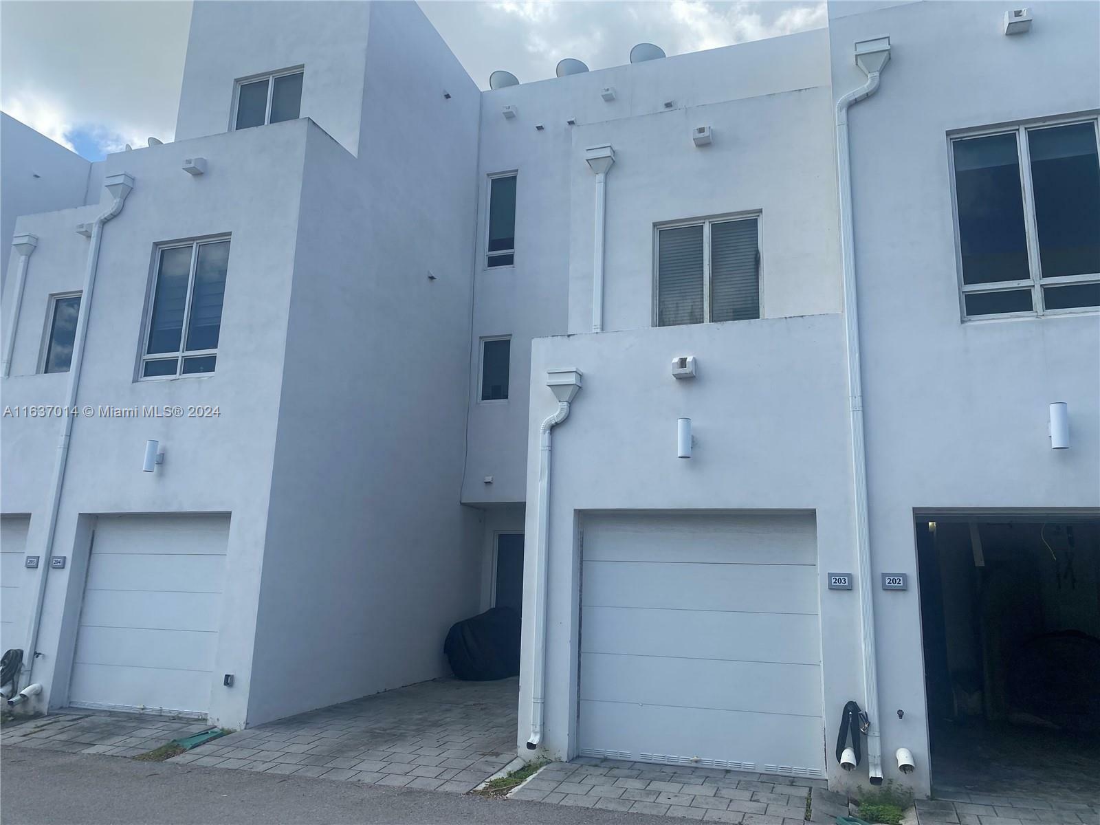 Property Photo:  10305 NW 63rd Ter 203  FL 33178 