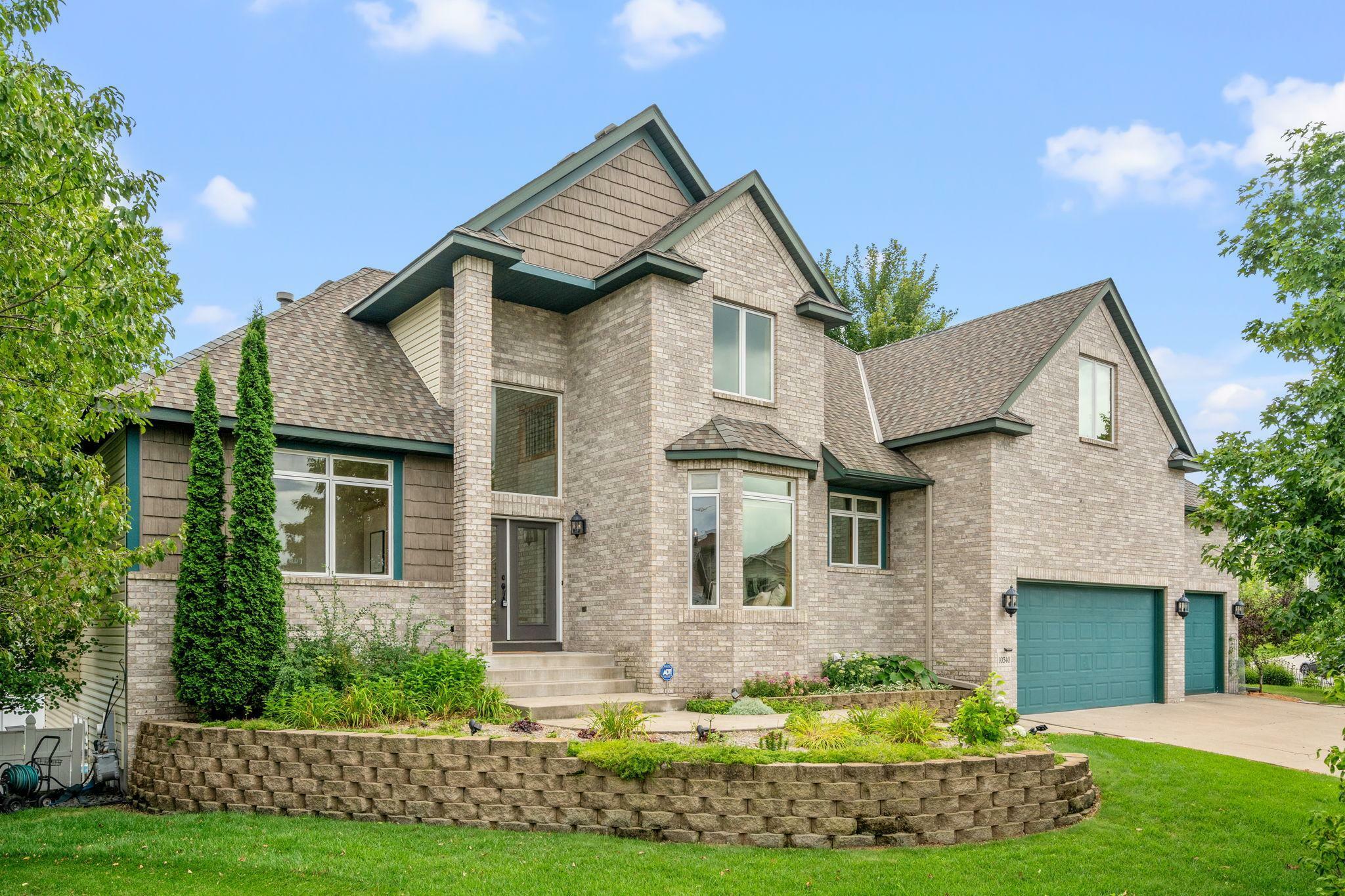 Property Photo:  10340 Orchard Trail N  MN 55443 