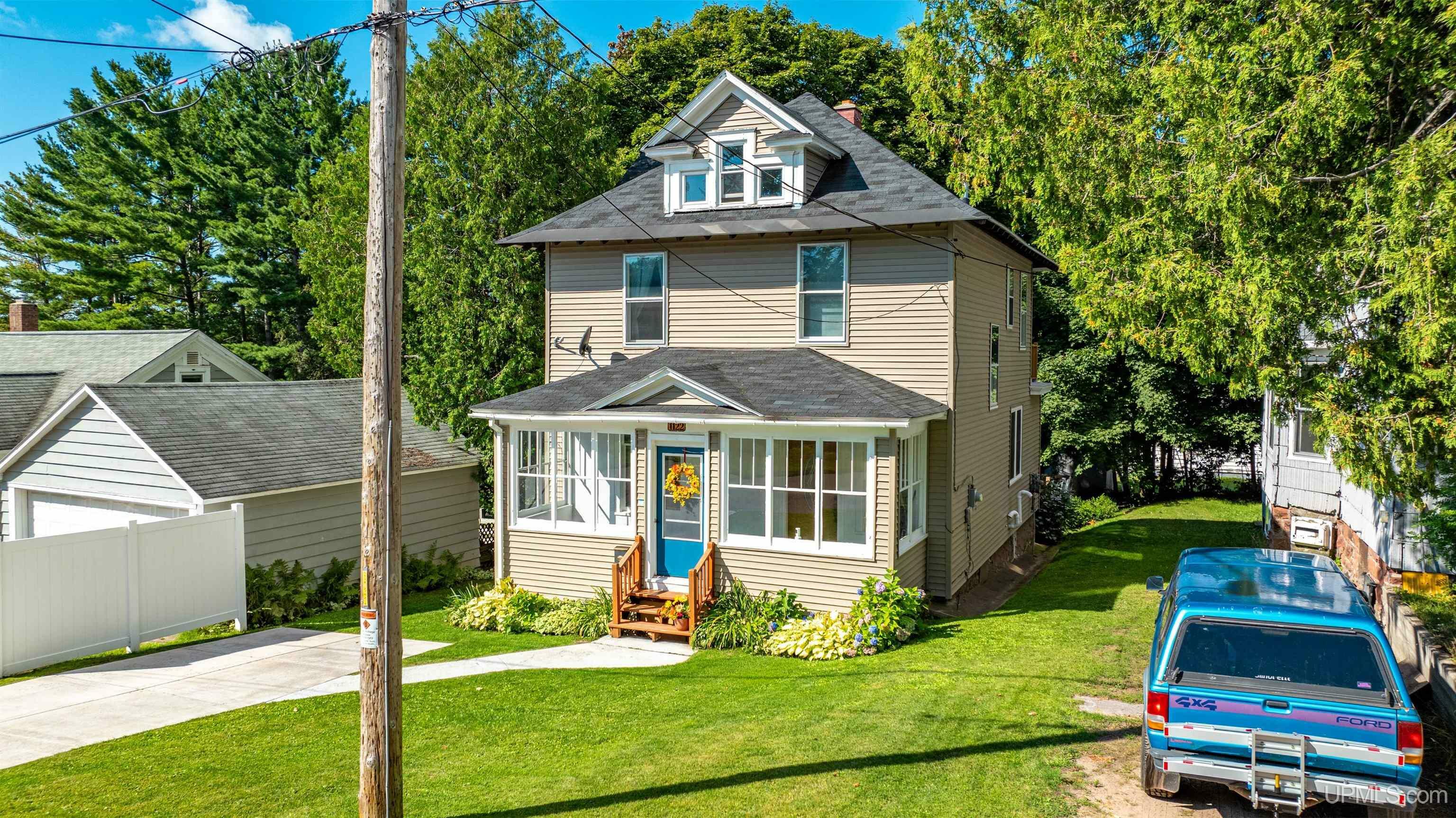 Property Photo:  1122 Summit Street  MI 49930 