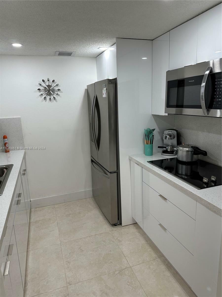 Property Photo:  1551 SW 135th Ter 203G  FL 33027 