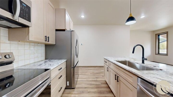Property Photo:  1 A Timberline Townhomes  MT 59068 