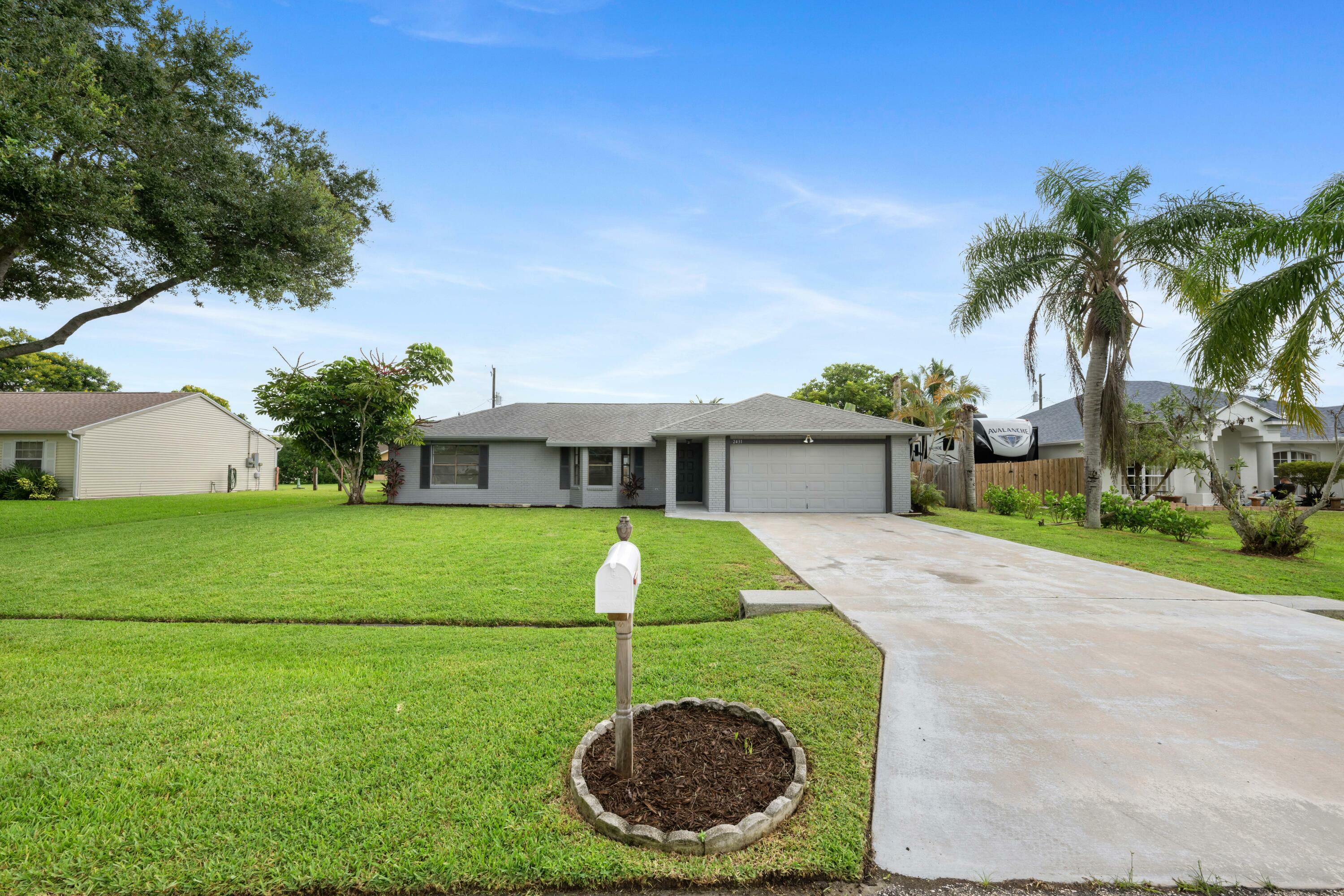 Property Photo:  2431 SE Shell Avenue  FL 34952 