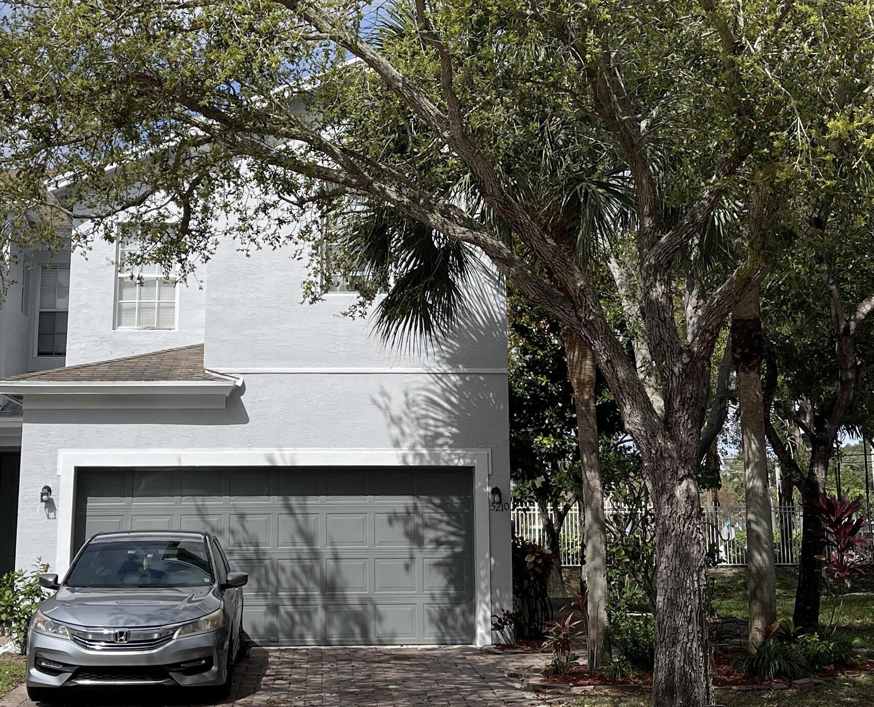 Property Photo: 5210 White Oleander FL 33415