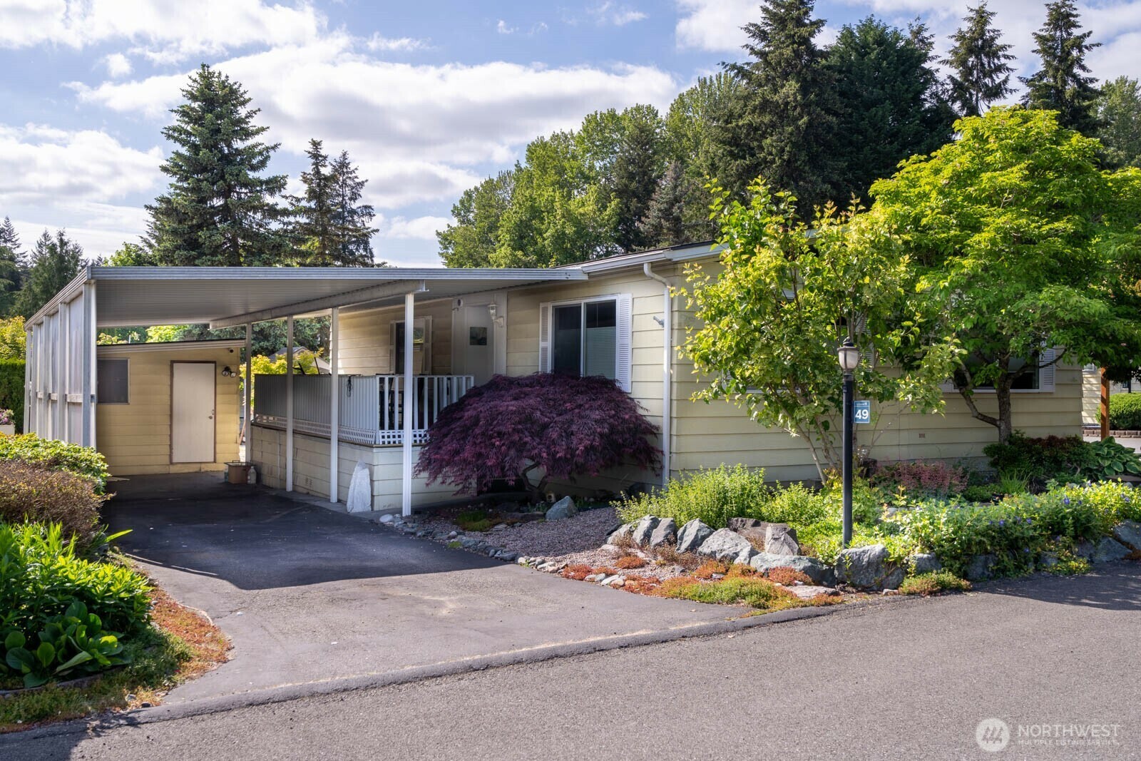 Property Photo: 1121 244th Street SW 49 WA 98021