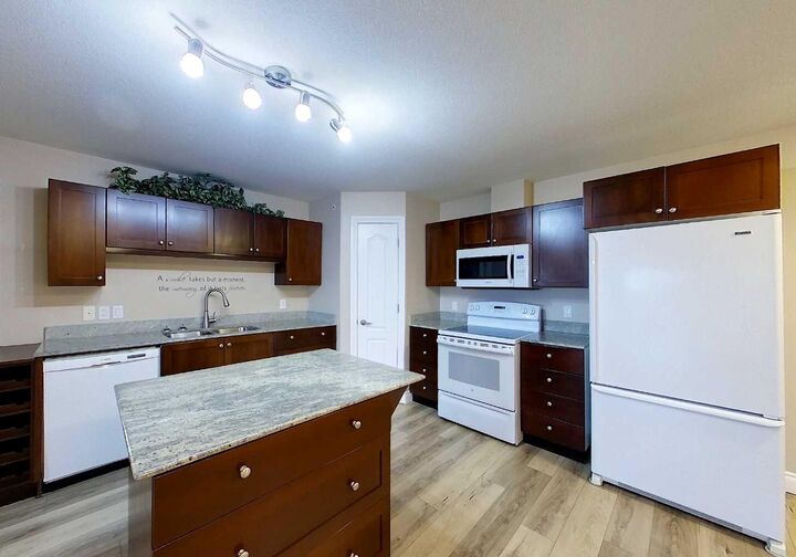 Property Photo: 5037 7 Avenue 406 AB T7E 0A8
