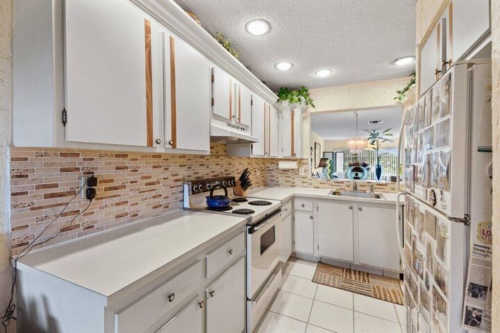 Property Photo: 13465 Fishtail Palm Court E FL 33484