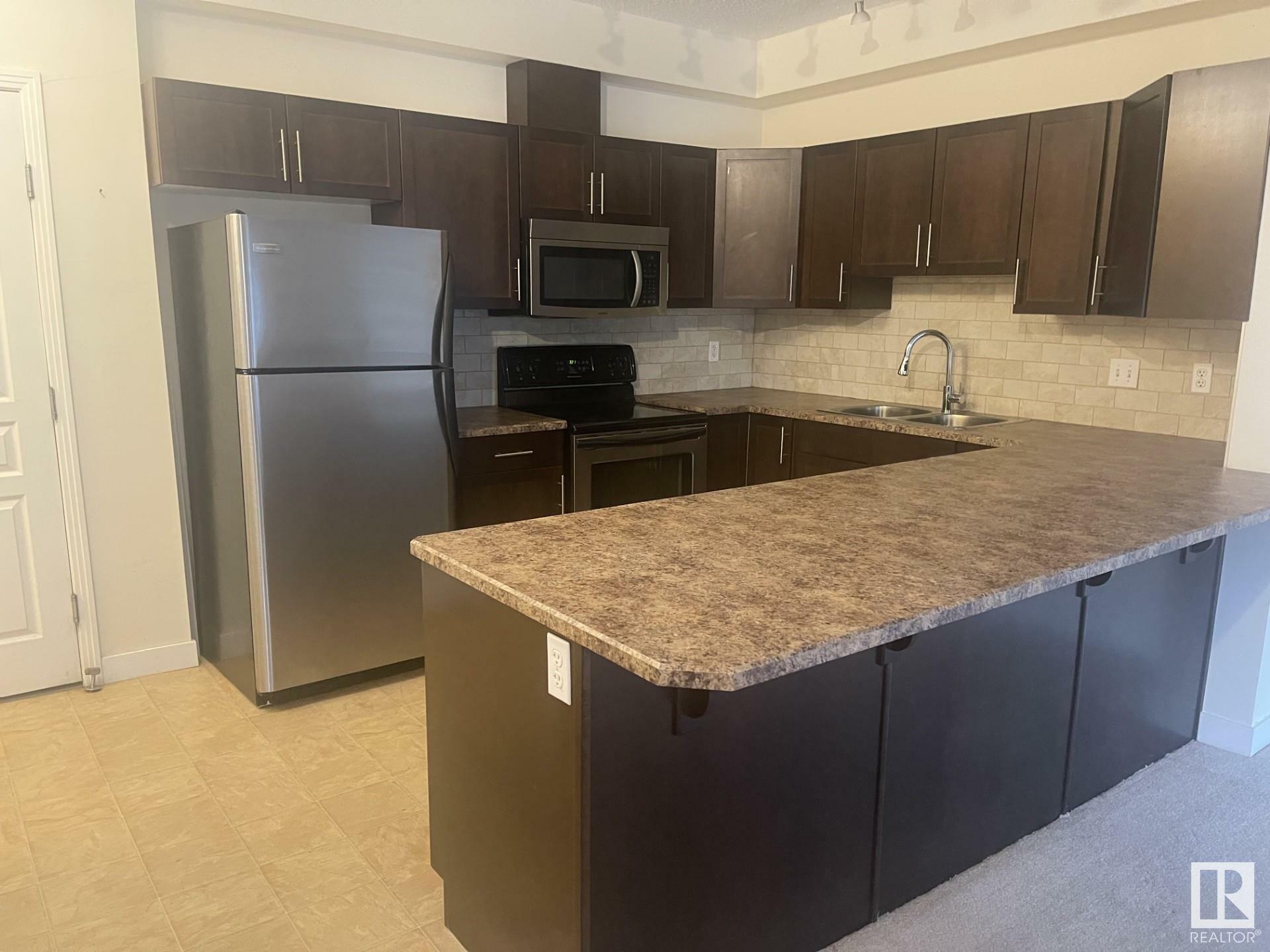 Property Photo: 2035 Grantham Cournt NW 105 AB T5T 3X4
