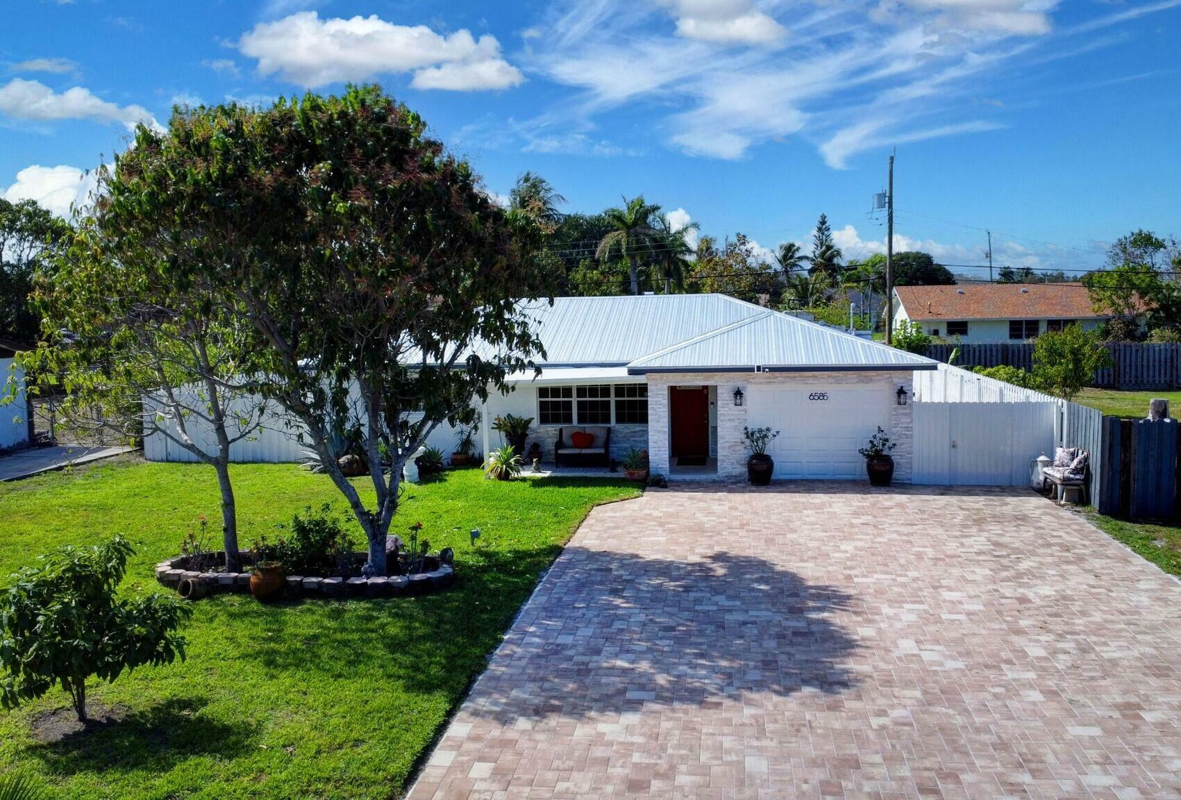 Property Photo: 6585 Osborne Drive FL 33462