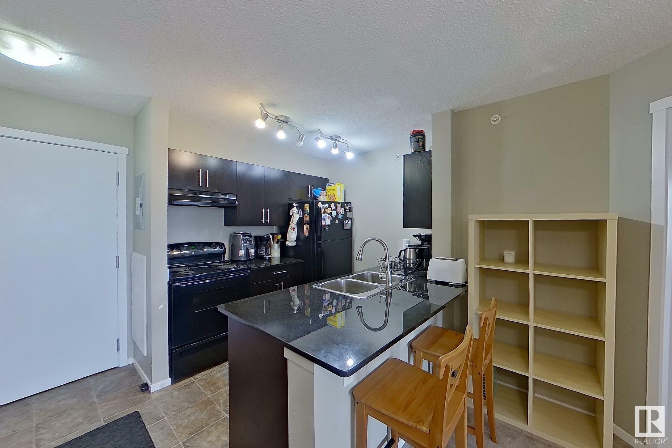 Property Photo: 3315 James Mowatt Trail SW 429 AB T6W 3L9