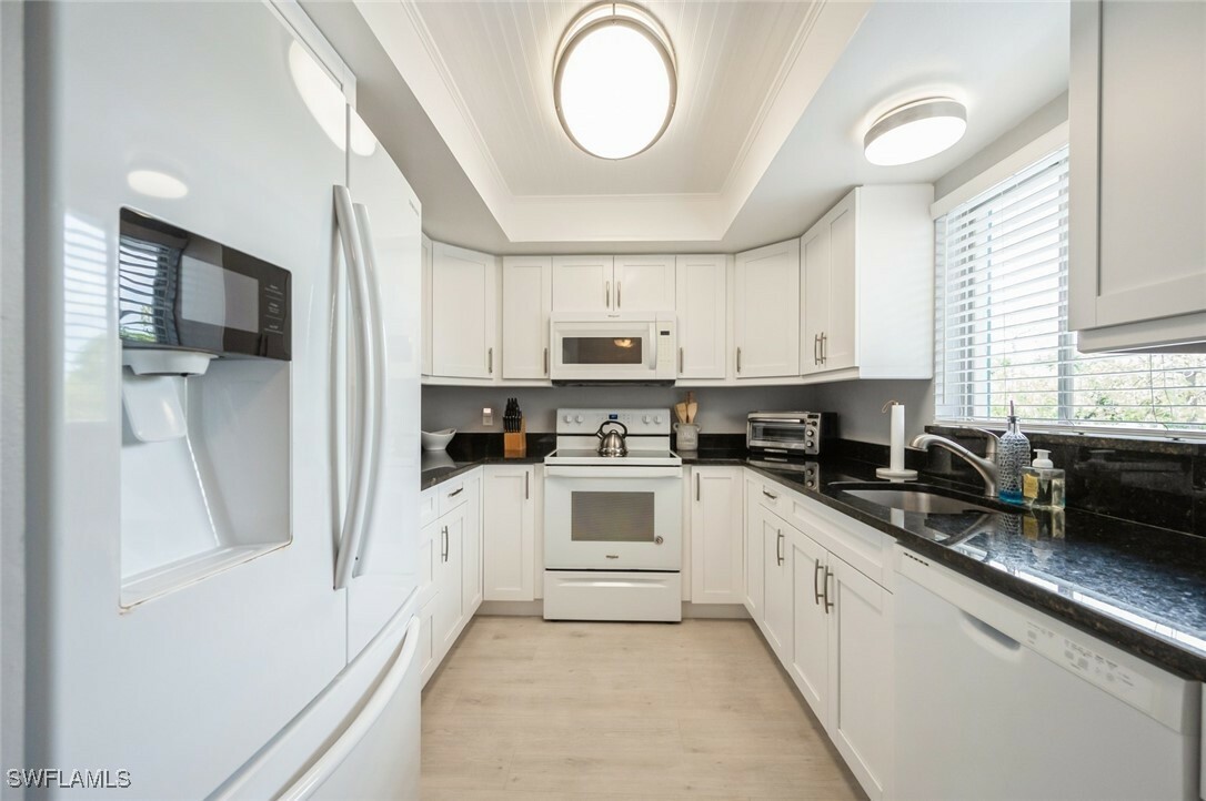 Property Photo:  5651 Rattlesnake Hammock Road C-201  FL 34113 