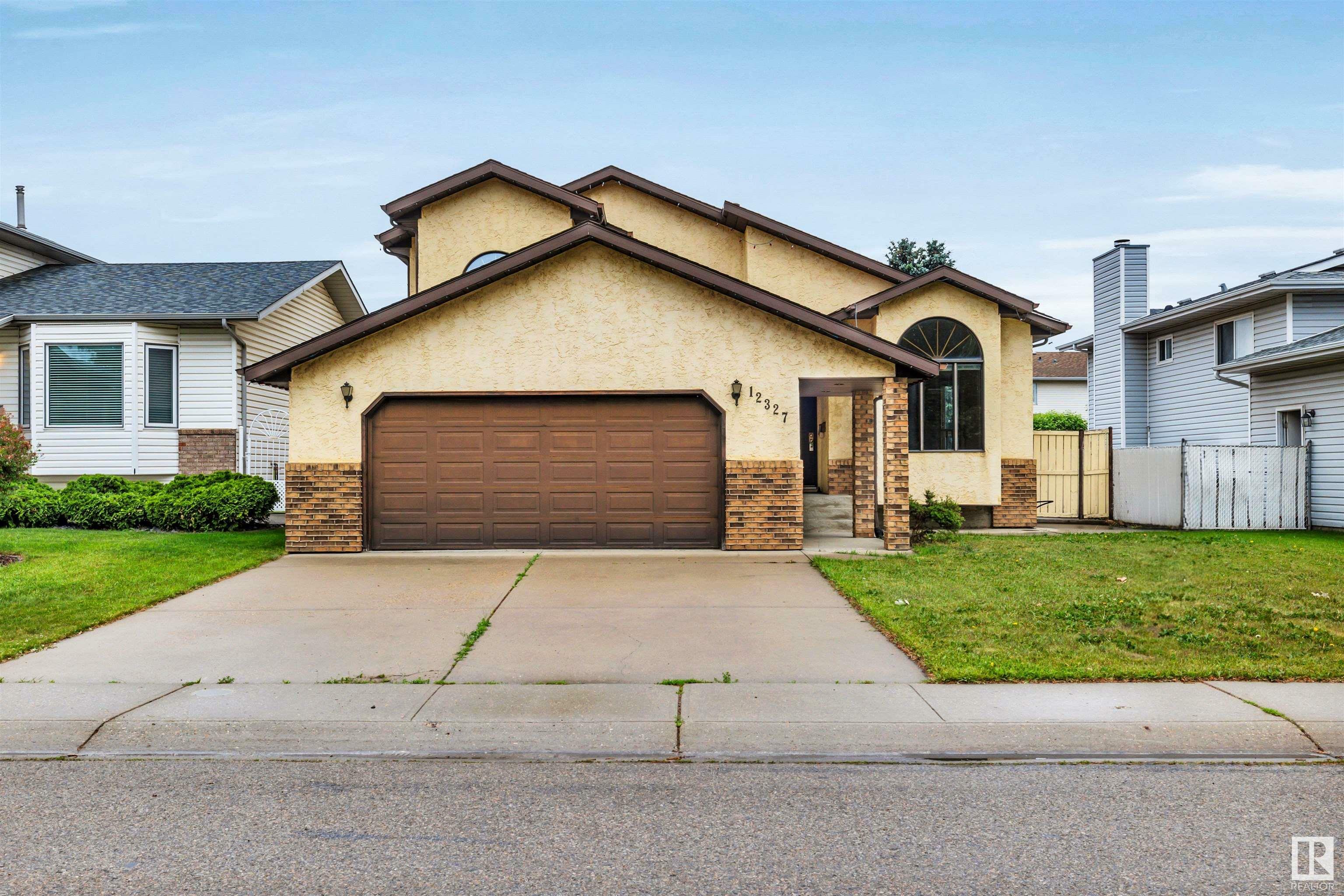 Property Photo: 12327 57 Street NW AB T5W 5E8