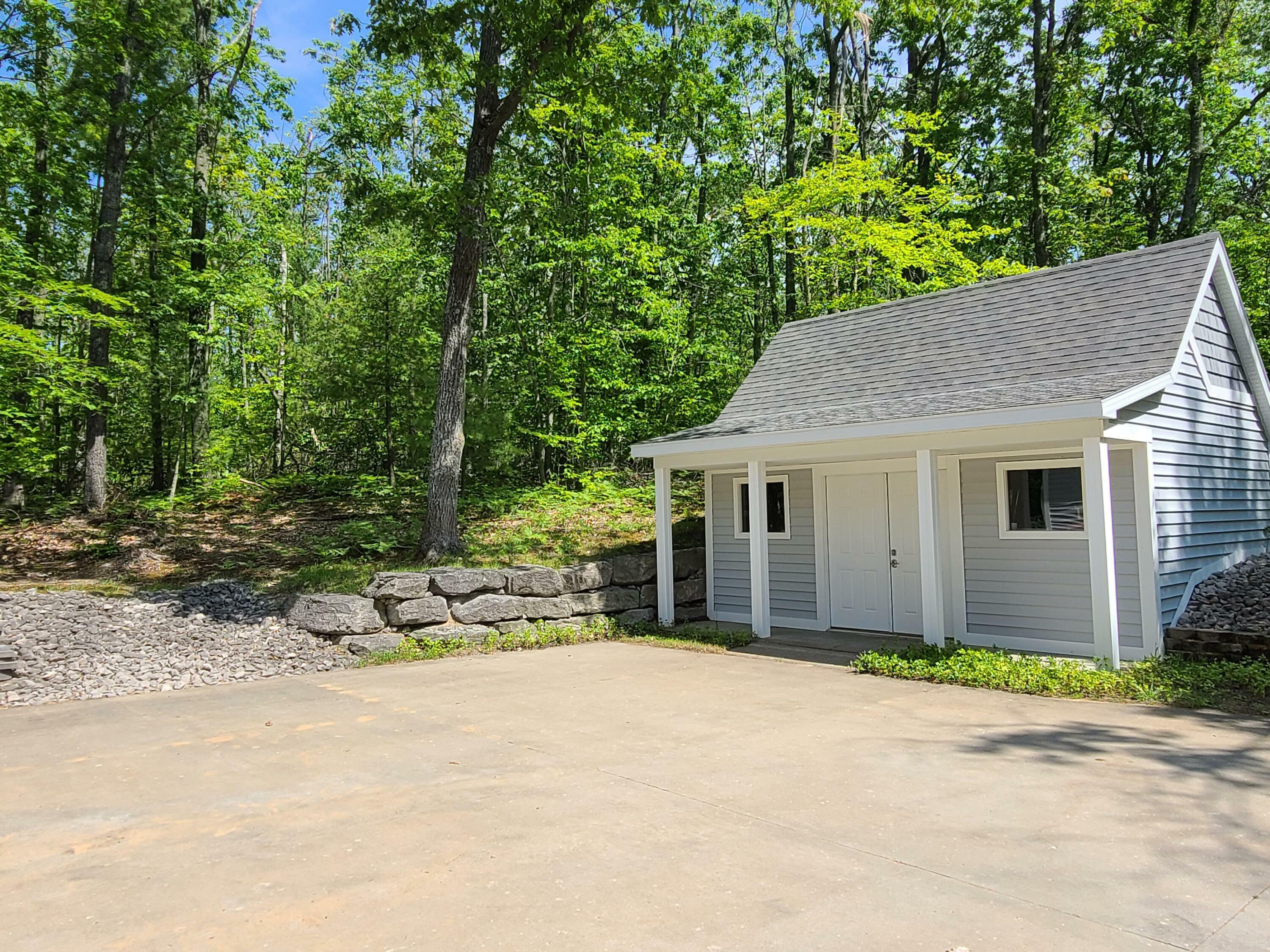 Property Photo:  5825 Arawak Pass  MI 49735 