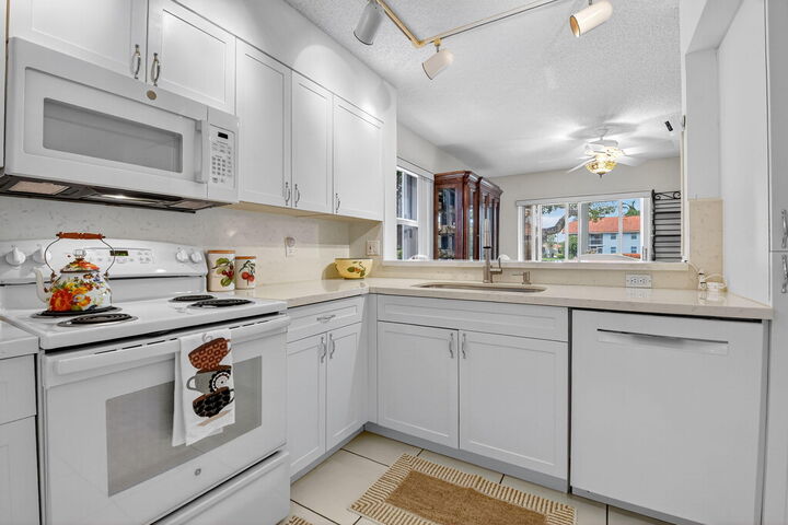 Property Photo:  7390 Lake Meadow Way 101  FL 33437