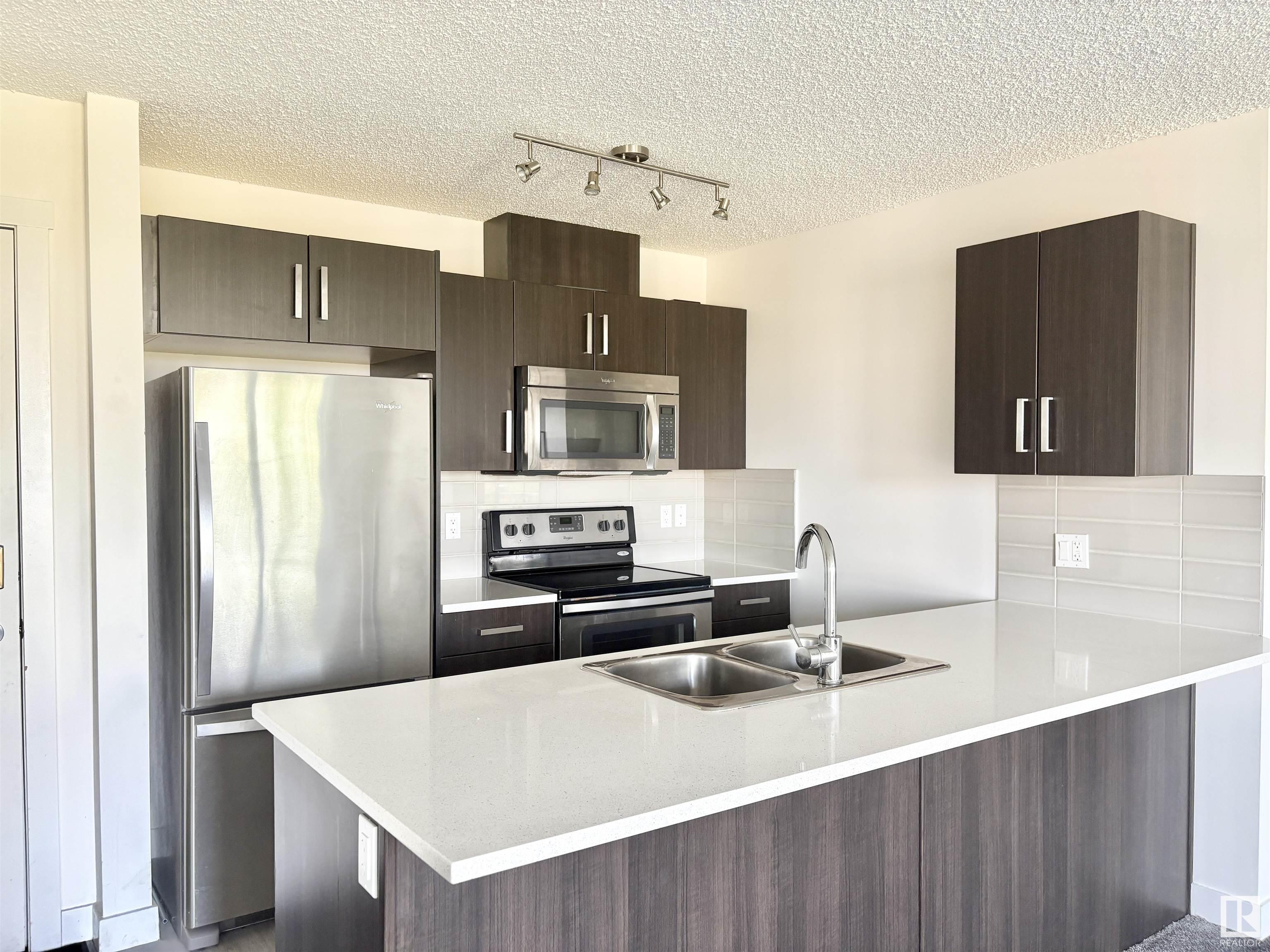 Property Photo: 667 Watt Boulevard SW 312 AB T6X 0Y2