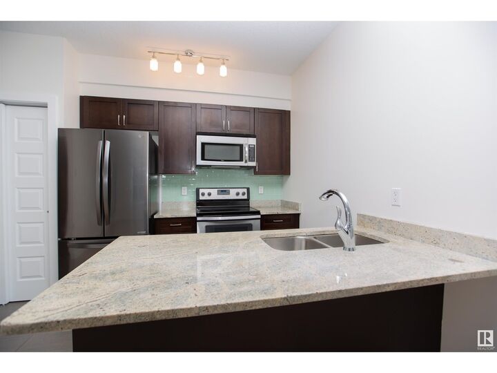 Property Photo:  #304 1238 Windermere Wy SW  AB T6W 2J3 