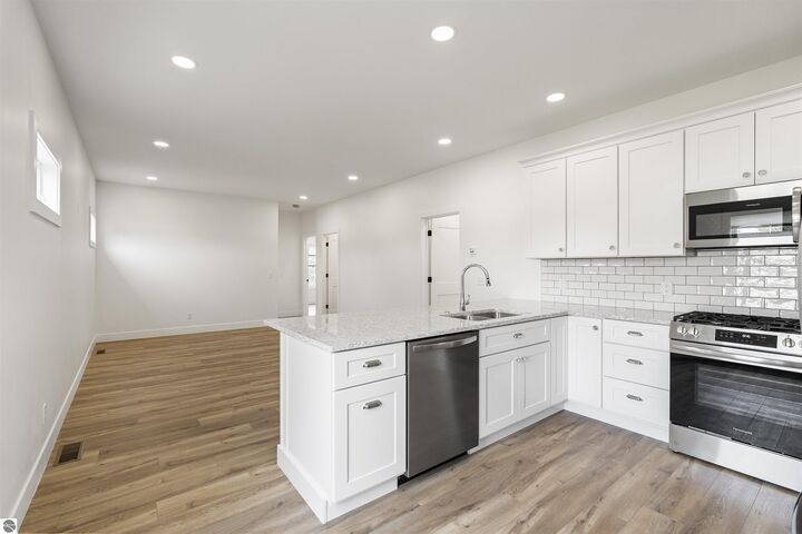 Property Photo:  202 W Carpenter Street  MI 49720 