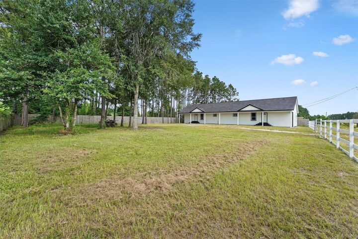 Property Photo:  711 Road 5014  TX 77327 