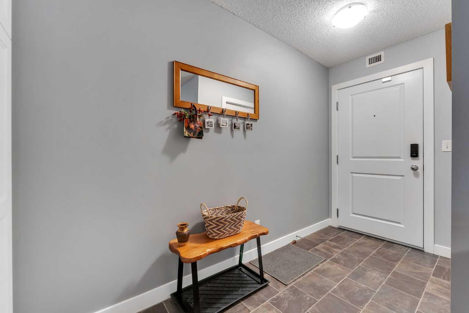 Property Photo:  403 Mackenzie Way SW 8301  AB T4B 3V7 
