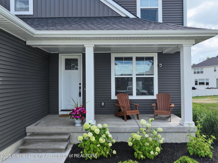 Property Photo:  621 Titanium Trail  MI 48840 