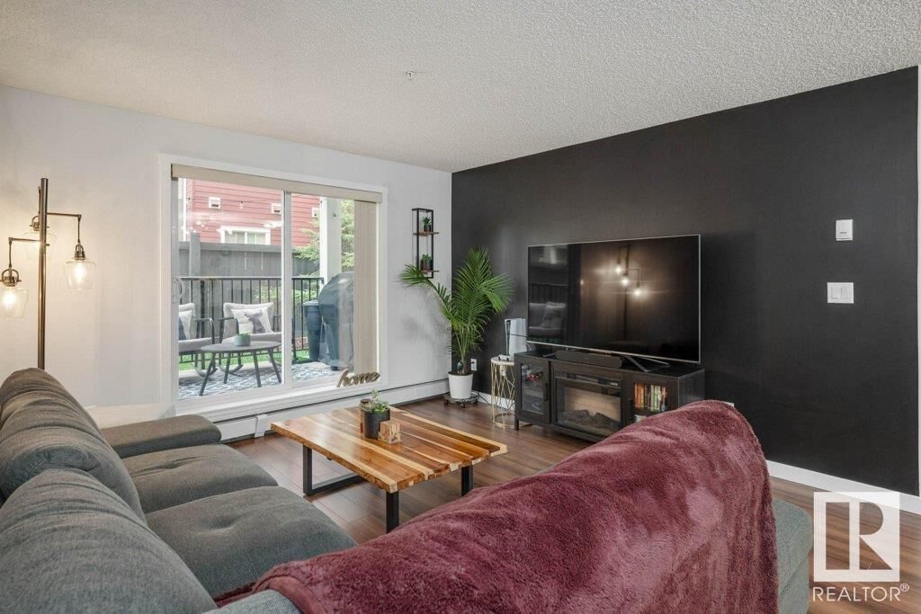 Property Photo:  #138 6076 Schonsee Wy NW  AB T5Z 0K8 