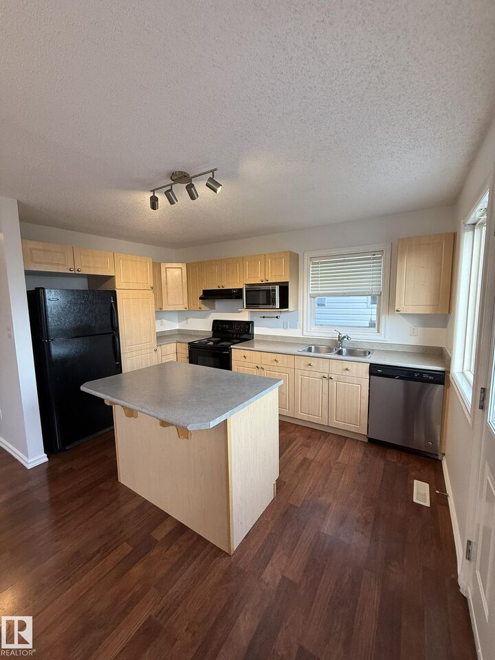 Property Photo:  2439 28B Avenue NW  AB T6T 2A3