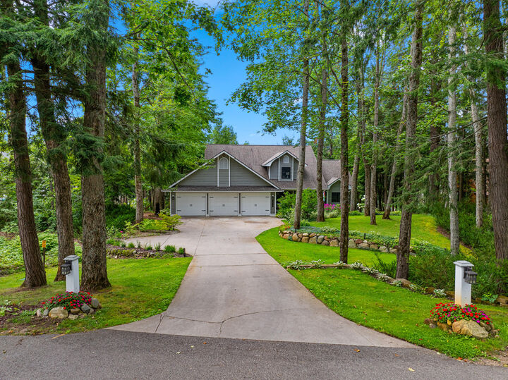 Property Photo: 5877 Shore Orchid Drive MI 49735
