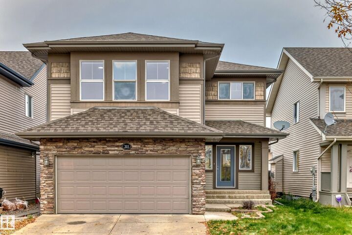 Property Photo: 203 Caldwell Way NW AB T6M 2X2