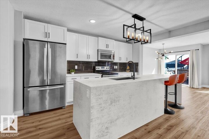 Property Photo: 7273 Armour Cr SW AB T6W 2S1