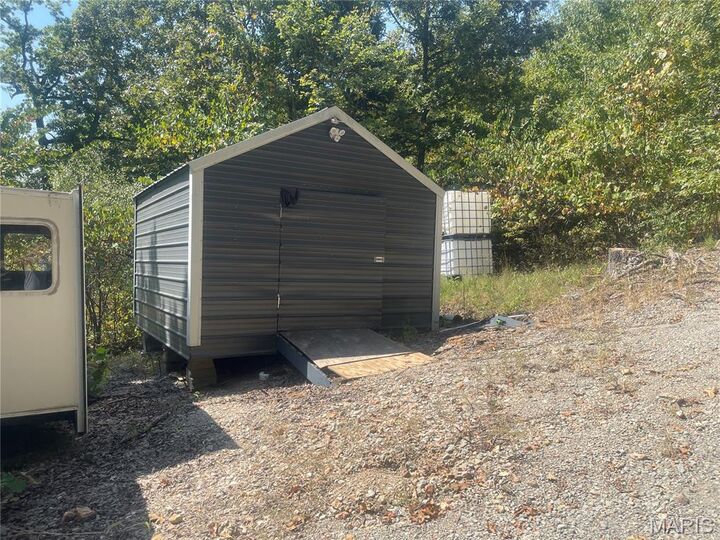 Property Photo:  9220 Mulqueen Lane  MO 63036 