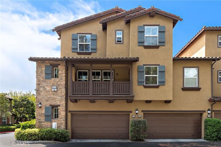 Property Photo:  115 Coral Rose  CA 92603