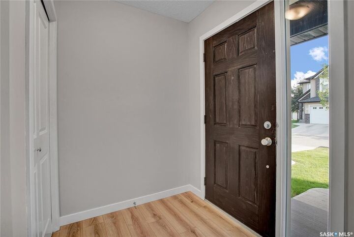 Property Photo: 410 Ledingham Way 213 SK S7V 0C4