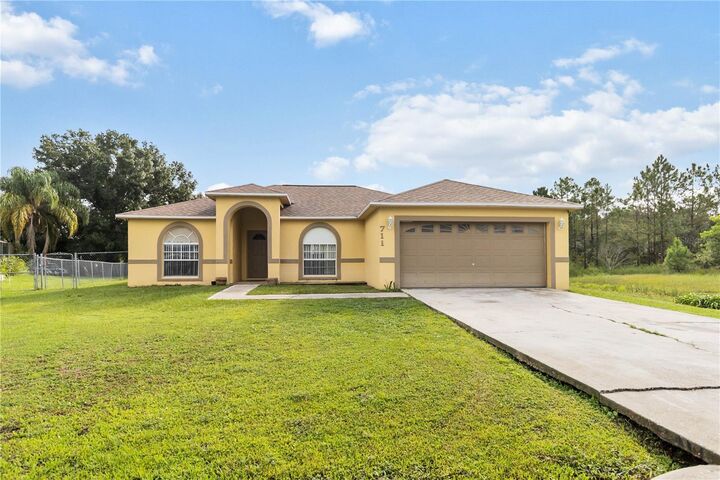 Property Photo:  711 Caracara Court  FL 34759 