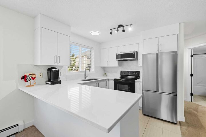 Property Photo:  7451 Springbank Boulevard SW 1211  AB T3H 4K5 