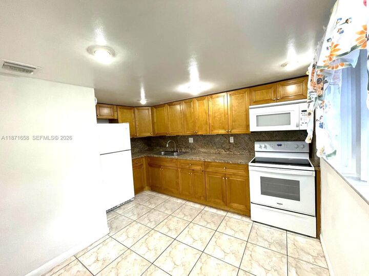 Property Photo:  1335 W 68th St 106  FL 33014 