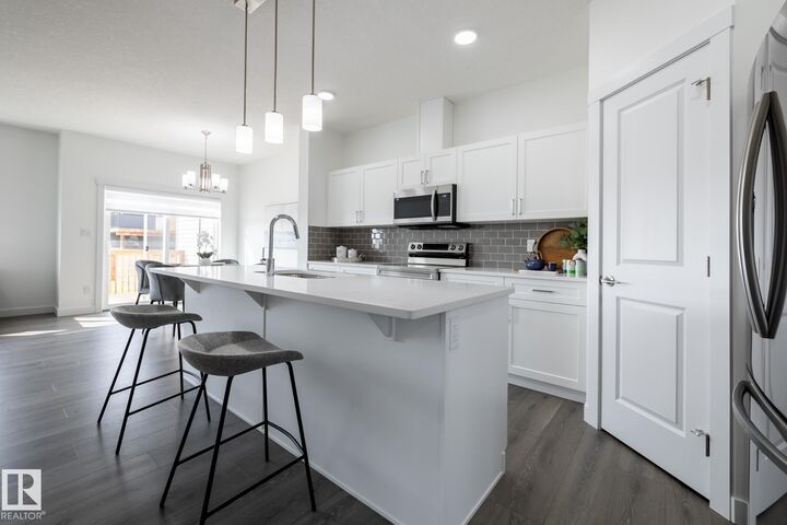 Property Photo:  8647 97 Avenue  AB T8R 2S1 