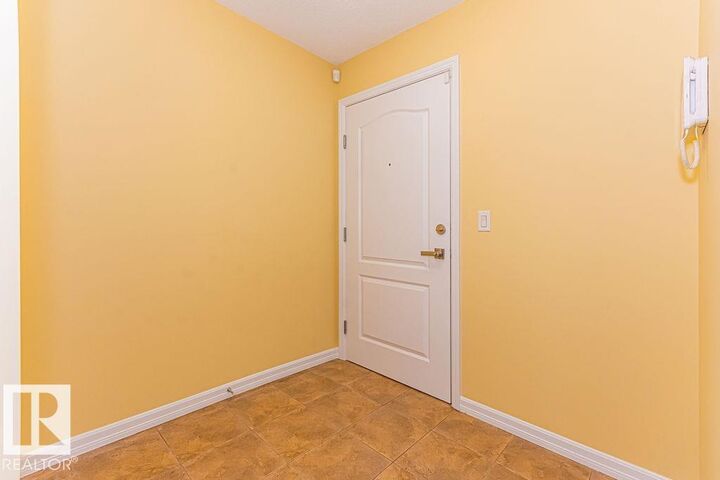 Property Photo: 271 Charlotte Way 105 AB T8H 0N9